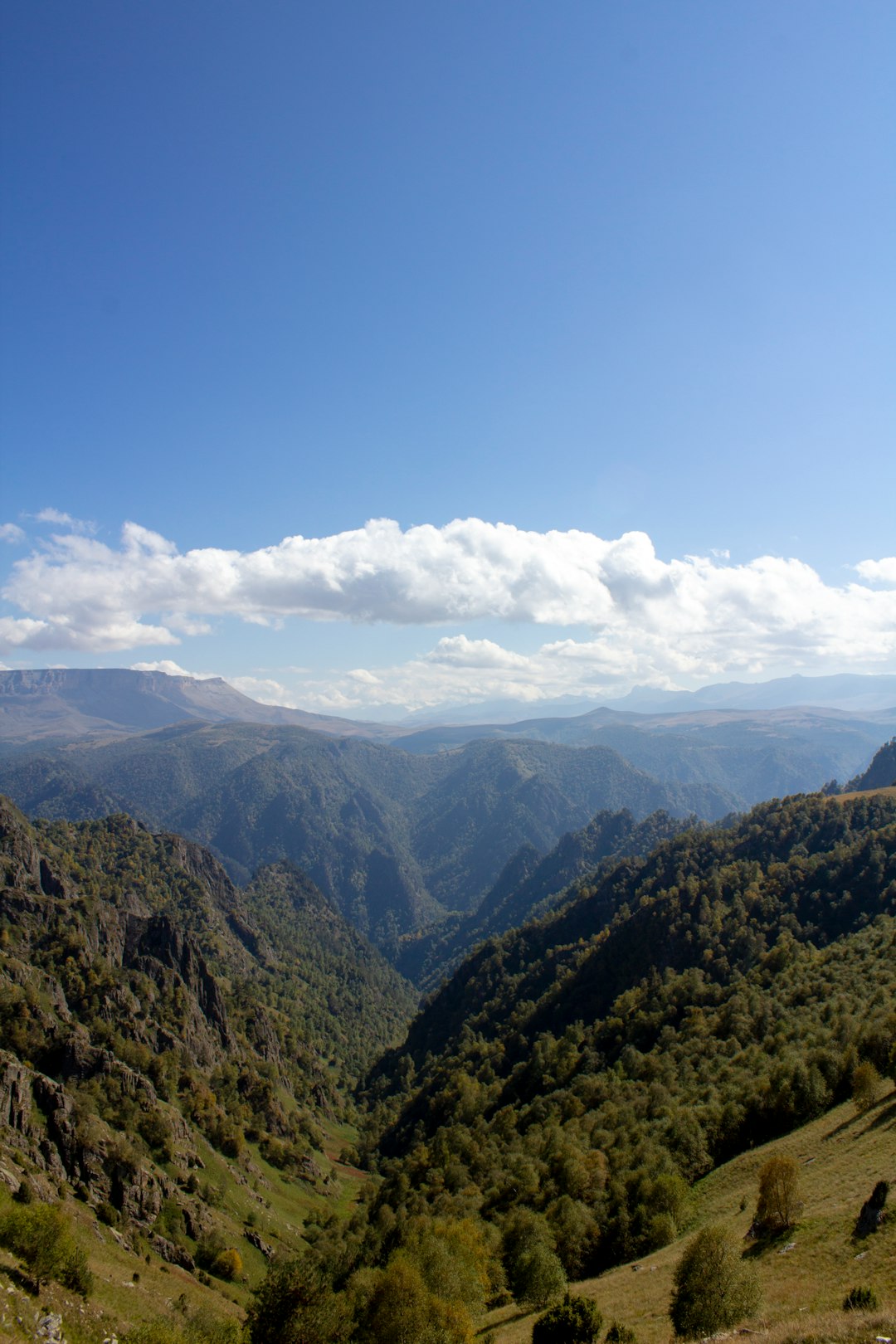 green-mountains-under-blue-sky-during-daytime-facyuagu5ha